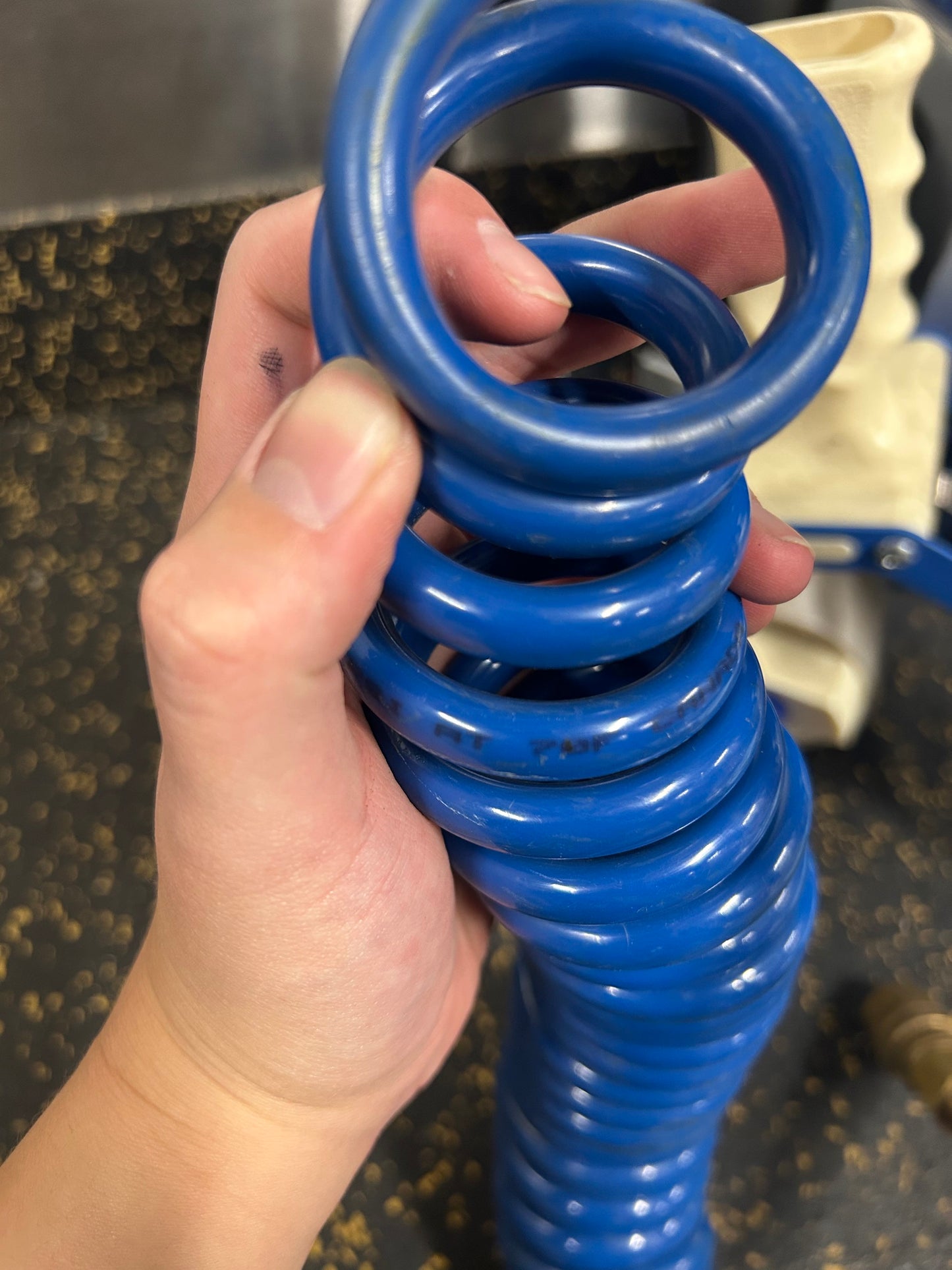 25-Foot 1/4” Diameter Coiled Air Hose with Male/Female Fittings (125 PSI Max Pressure)